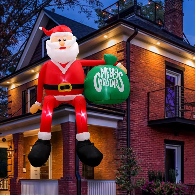 Figure gonflable Joyeux Noël assise sur le toit avec lumières LED pour le sac cadeau du Père Noël