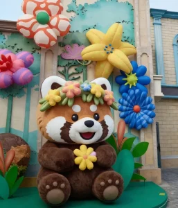 Professional Custom Giant Inflatable Raccoon Mascot With Flowers 3.3M High Plush Realistic Cartoon Inflatable Animal Model