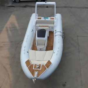 Hard fiberglass rigid inflatable boat (RIB) for surfing, fishing, and rescue outdoor activities